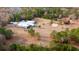 Aerial view of a property showcasing a large building, a pond, and surrounding greenery at 280 Royalegates Ct, Cross, SC 29436