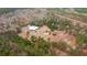 Aerial view featuring a house, pond, and trees with a mix of green and autumn colors at 280 Royalegates Ct, Cross, SC 29436