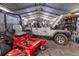 Garage featuring a Jeep, lawn mower, and ample storage space, perfect for hobbyists and car enthusiasts at 280 Royalegates Ct, Cross, SC 29436