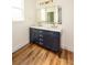 Bathroom vanity featuring double sinks, white countertop, and dark blue cabinets at 2836 Edenborough Rd, Johns Island, SC 29455