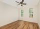 An empty bedroom with two windows, wood floors and a ceiling fan at 2836 Edenborough Rd, Johns Island, SC 29455