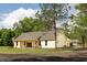 Exterior angle of the home with a covered patio and large backyard at 2836 Edenborough Rd, Johns Island, SC 29455