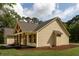 Side view of a home with a covered porch, wood supports and manicured lawn at 2836 Edenborough Rd, Johns Island, SC 29455