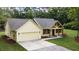 Charming exterior elevation featuring a two-car garage and timber-framed porch at 2836 Edenborough Rd, Johns Island, SC 29455