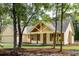 Charming home featuring a gabled roof and inviting front porch with beautiful wood accents at 2836 Edenborough Rd, Johns Island, SC 29455