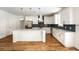 Well-lit kitchen with white cabinets, stainless steel appliances, and a large center island at 2836 Edenborough Rd, Johns Island, SC 29455