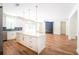 Modern kitchen with white island, shaker cabinets, subway tile backsplash, stainless appliances and open floor plan at 2836 Edenborough Rd, Johns Island, SC 29455