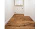 A laundry room featuring wood-look flooring and a built-in cabinet above the hookups at 2836 Edenborough Rd, Johns Island, SC 29455