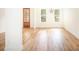 Bright, unfurnished living room featuring hardwood floors, natural light, and a stylish front door at 2836 Edenborough Rd, Johns Island, SC 29455