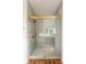Luxurious shower with gold hardware, elegant tile and glass door at 2836 Edenborough Rd, Johns Island, SC 29455