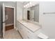 Bathroom featuring granite counters and a large mirror at 287 Commonwealth Rd, Mount Pleasant, SC 29466