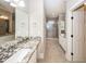 Bathroom featuring granite countertops, tiled floor, and a walk-in shower at 287 Commonwealth Rd, Mount Pleasant, SC 29466