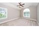 Spacious bedroom with neutral walls, plush carpeting, and a ceiling fan for comfort at 287 Commonwealth Rd, Mount Pleasant, SC 29466