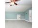 Spacious bedroom with vaulted ceilings, light blue walls, a fan and multiple storage areas at 287 Commonwealth Rd, Mount Pleasant, SC 29466