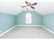 Spacious bedroom with vaulted ceilings, a fan, an arched window and soft light blue walls at 287 Commonwealth Rd, Mount Pleasant, SC 29466