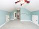 Large bedroom with vaulted ceilings, a fan, light blue walls, and multiple access and storage areas at 287 Commonwealth Rd, Mount Pleasant, SC 29466
