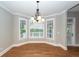 Bright dining area featuring a bay window and chandelier at 287 Commonwealth Rd, Mount Pleasant, SC 29466