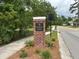 Community entrance sign with brick base and lush landscaping at 287 Commonwealth Rd, Mount Pleasant, SC 29466