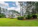 Exterior view of the home with lush landscaping and a well manicured lawn at 287 Commonwealth Rd, Mount Pleasant, SC 29466