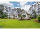Front exterior view of the house with its lawn and landscaping at 287 Commonwealth Rd, Mount Pleasant, SC 29466