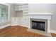 Close up of a fireplace with white trim and built-in cabinets and shelves at 287 Commonwealth Rd, Mount Pleasant, SC 29466