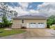 View of the three car garage and the side yard at 287 Commonwealth Rd, Mount Pleasant, SC 29466