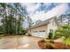 View of the three car garage and the driveway at 287 Commonwealth Rd, Mount Pleasant, SC 29466