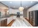 Spacious kitchen featuring a large island, stainless steel appliances, and white cabinets at 287 Commonwealth Rd, Mount Pleasant, SC 29466