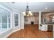 Open living area showing the fireplace, windows, and hardwood floors at 287 Commonwealth Rd, Mount Pleasant, SC 29466