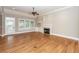 Bright living room featuring a fireplace, ceiling fan, and access to the outdoors at 287 Commonwealth Rd, Mount Pleasant, SC 29466