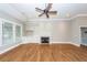 Open living area with a ceiling fan, fireplace, and built-in shelving at 287 Commonwealth Rd, Mount Pleasant, SC 29466