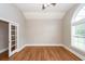 Room with hard wood floors, a ceiling fan, and glass paneled doors at 287 Commonwealth Rd, Mount Pleasant, SC 29466