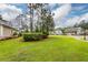 Manicured front yard with view of the street and other homes in the neighborhood at 287 Commonwealth Rd, Mount Pleasant, SC 29466
