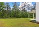 Lush backyard with mature trees and ample space, offering privacy and a connection to nature at 296 Torslanda Ln, Summerville, SC 29486