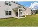 Backyard featuring a covered patio, a well-maintained lawn, and privacy from neighboring homes at 296 Torslanda Ln, Summerville, SC 29486