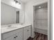 Bathroom with double vanity and lots of natural light with a shower visible through a door at 296 Torslanda Ln, Summerville, SC 29486