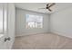 Bedroom with neutral carpet, a ceiling fan, and window allowing plenty of natural light into the living space at 296 Torslanda Ln, Summerville, SC 29486