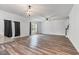Open living room with hardwood floors, lots of light and access to the backyard at 296 Torslanda Ln, Summerville, SC 29486