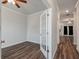 Spacious room featuring hardwood floors, a ceiling fan, and french doors at 296 Torslanda Ln, Summerville, SC 29486