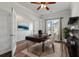 Bright office featuring hardwood floors, a ceiling fan, french doors and modern furnishings at 296 Torslanda Ln, Summerville, SC 29486