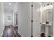 Well-lit powder room featuring a pedestal sink and modern fixtures at 296 Torslanda Ln, Summerville, SC 29486