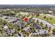 Aerial view of a home near a golf course, tennis courts, and scenic ponds at 300 Ginned Cotton St, Charleston, SC 29492