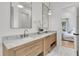 This bathroom features a double vanity, marble countertops, and stylish fixtures, offering comfort and elegance at 300 Ginned Cotton St, Charleston, SC 29492