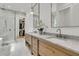 This bathroom features a double vanity, marble countertops, and stylish fixtures, offering comfort and elegance at 300 Ginned Cotton St, Charleston, SC 29492