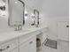 Bright bathroom with double vanity, modern fixtures, and white cabinetry, and stylish lighting at 300 Ginned Cotton St, Charleston, SC 29492