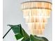 Modern, tiered chandelier complemented by lush green plants at 300 Ginned Cotton St, Charleston, SC 29492