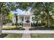 Welcoming home exterior featuring a front porch, brick stairs, and beautifully landscaped yard creating curb appeal at 300 Ginned Cotton St, Charleston, SC 29492