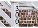 Close up of the number 300 on the front of the house with a brick background at 300 Ginned Cotton St, Charleston, SC 29492