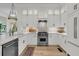 Modern kitchen with white cabinetry, stainless steel appliances, and a stylish tile backsplash at 300 Ginned Cotton St, Charleston, SC 29492