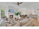 Bright, open-concept living room with a fireplace, modern furnishings, and stylish decor at 300 Ginned Cotton St, Charleston, SC 29492